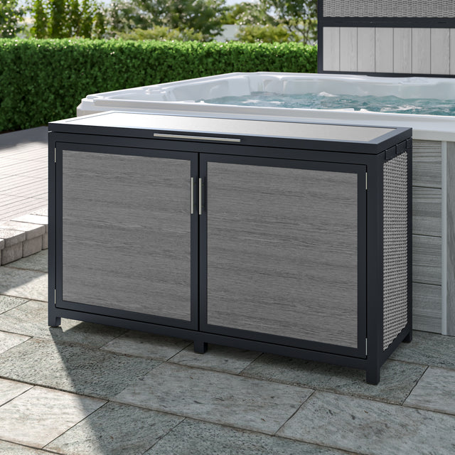 Gray wicker deck box beside hot tub on outdoor patio