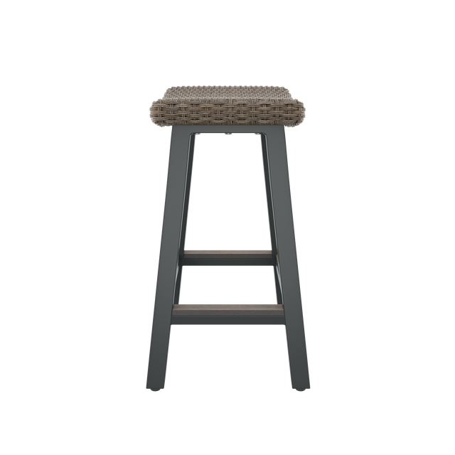 Side of brown bar stool with contoured seat and footrest