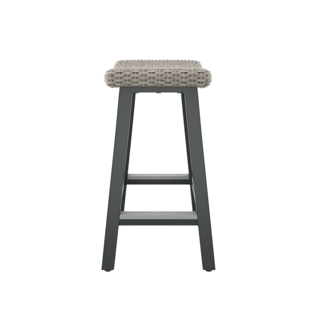 Side of gray bar stool with contoured seat and footrest