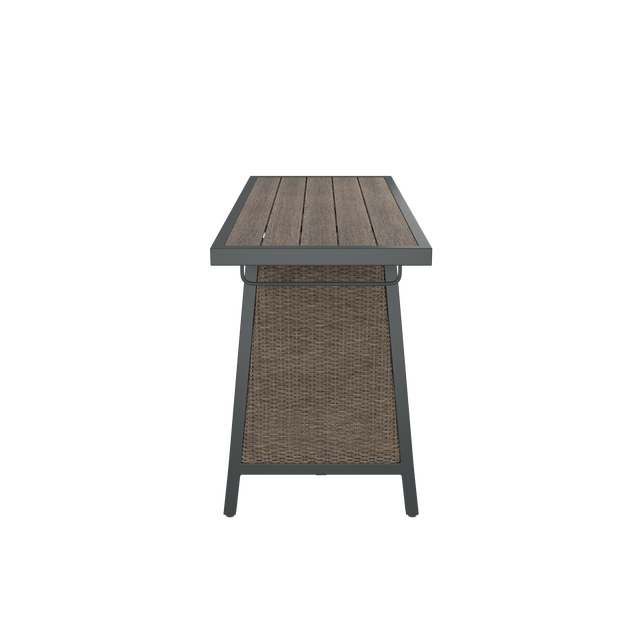 Side of brown dining table with wood effect top, wicker side, and towel rack