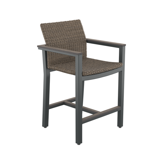 Angled brown high-backed bar chair with armrests and footrest 